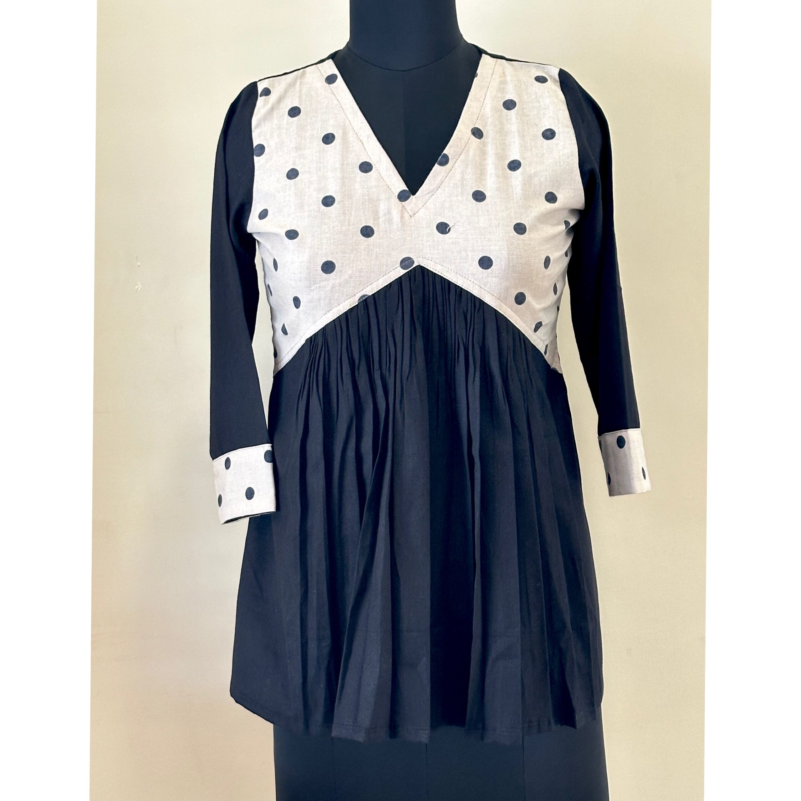 Black and white polka dot inverted yoke top